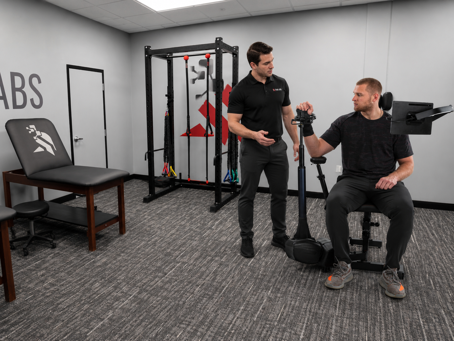 TKM Labs physical therapist working with a patient on the Humero Tech C1